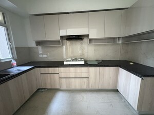 Kitchen in 2.5 BHK Apartment at Smart World Gems, Sector 89 – for Rent