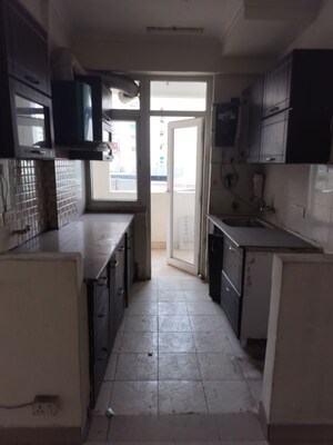 Kitchen in 2.5 BHK Apartment at Amrapali Silicon City, Sector 76 – for Sale