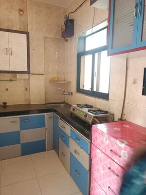 Kitchen in 1.5 BHK Apartment at Yashraj Park CHS, Kasarvadavali – for Rent