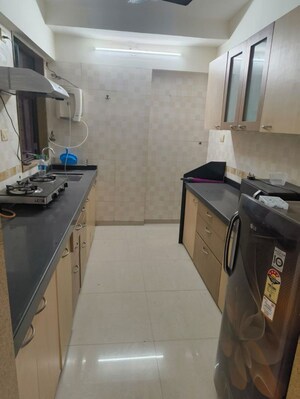 Kitchen in 3 BHK Apartment at Riddhi Tower, Malad East – for Rent