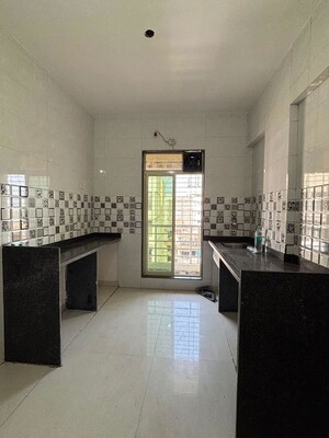 Kitchen in 2 BHK Apartment at Aparna Society, Dombivli West – for Rent