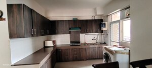Kitchen in 3 BHK Apartment at Mahagun Mywoods, Sector 16c Greater Noida – for Rent