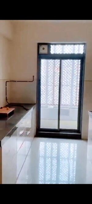 Kitchen in 2 BHK Apartment at Piramal Vaikunth, Balkum Pada – for Rent