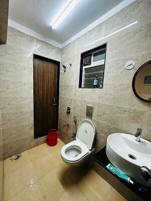 Bathroom in 2 BHK Apartment at Raunak Paradise, Kokanipada – for Rent