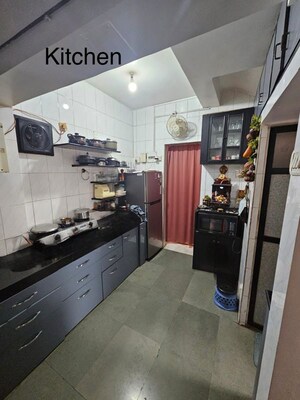 Kitchen in 2 BHK Apartment at Mangalya CHS Naupada, Naupada – for Sale