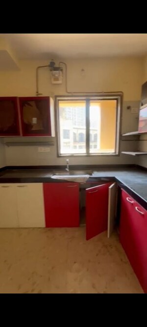 Kitchen in 2 BHK Apartment at Swastik Regalia, Waghbil – for Rent