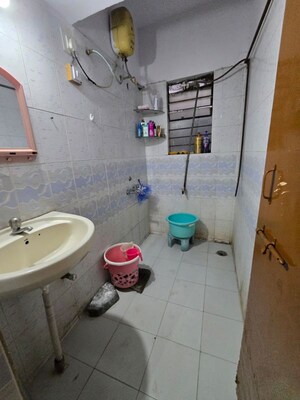 Bathroom in 1.5 BHK Apartment at Wadgaon Sheri – for Rent