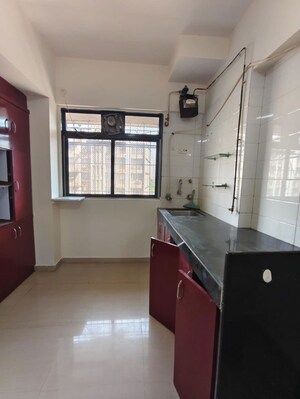 Kitchen in 1 BHK Apartment at Raunak Unnathi Greens, Kasarvadavali – for Rent