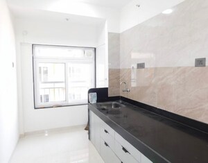 Kitchen in 3 BHK Apartment at Dhoot Sky Residency New Sonali CHSL, Malad West – for Rent