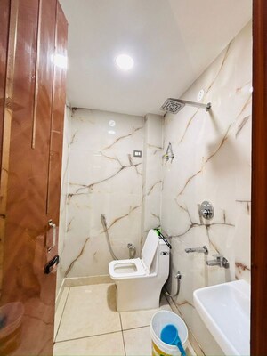 Bathroom in 3 BHK Builder Floor at Dwarka Mor – for Rent