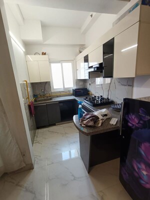 Kitchen in Studio Apartment at Purvanchal Royal City, Chi V Greater Noida – for Rent