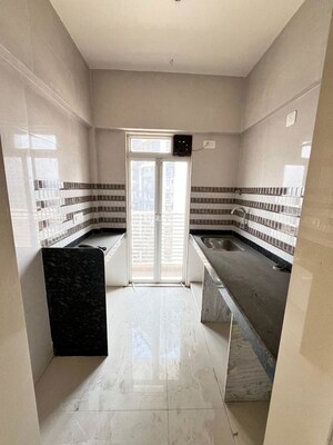 Kitchen in 1 BHK Apartment at JVM Corner Stone, Naupada – for Sale