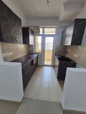 Kitchen in 3 BHK Apartment at Amrapali Heartbeat City, Sector 107 – for Sale