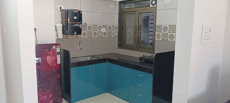 Kitchen, blue-berry 2 Bedroom 850 Sq.Ft. Apartment In Kharadi Pune 10156719