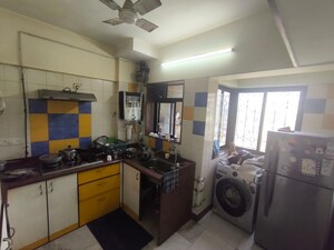 Kitchen in 2 BHK Apartment at Vikash Complex CHS, Uthalsar – for Rent