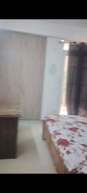 Bedroom in 2 BHK Apartment at AIMS Golf Town, Sector 4 Greater Noida – for Rent