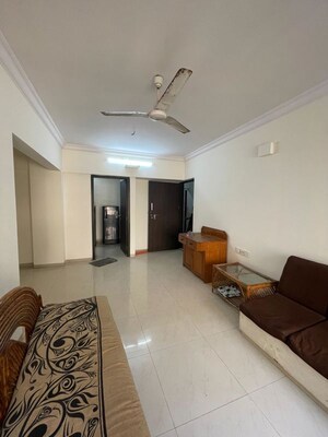 Living Room in 2 BHK Apartment at Aalind Link Palace CHS, Goregaon East – for Rent