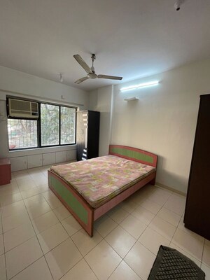 Bedroom in 2 BHK Apartment at Aalind Link Palace CHS, Goregaon East – for Rent