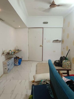Living Room in Studio Apartment at Royal Palms Garden View, Goregaon East – for Sale