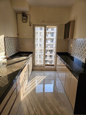 Kitchen in 2 BHK Apartment at Shree Tirupati STG Signature Residency, Patlipada – for Sale