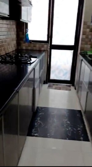 Kitchen in 4 BHK Apartment at Ajnara Grace, Raj Nagar Extension – for Rent