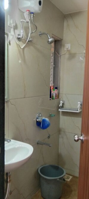 Bathroom in 1 BHK Apartment at Puranik City, Kasarvadavali – for Rent