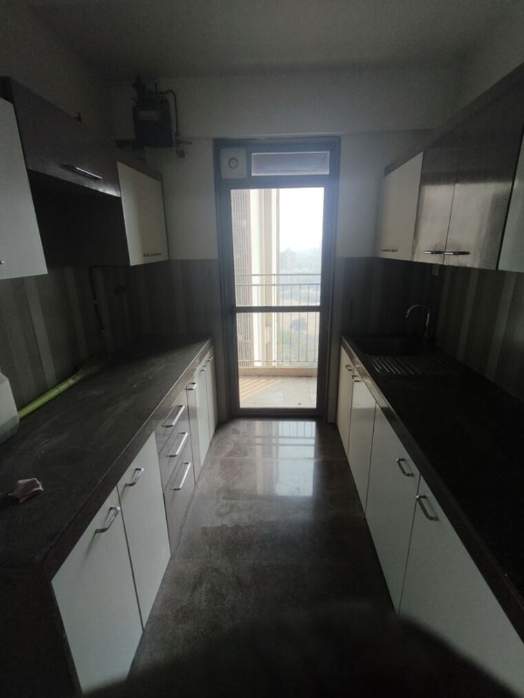 Kitchen, risland-the-icon 2 Bedroom 561 Sq.Ft. Apartment In Dhokali Thane 10159319
