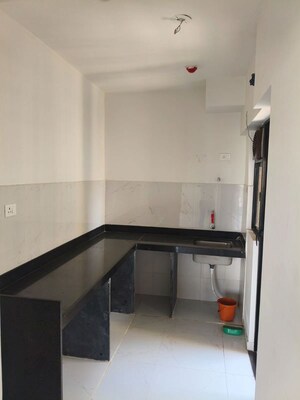 Kitchen in 2 BHK Apartment at Runwal Gardens Phase 2, Dombivli East – for Rent