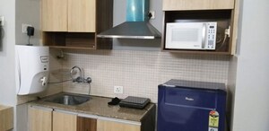 Kitchen in 1 RK Apartment at Supertech Eco Suites, Sector 137 – for Rent