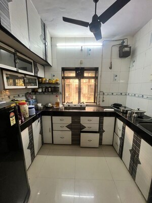 Kitchen in 1 BHK Apartment at Gokuldham Complex, Goregaon East – for Sale