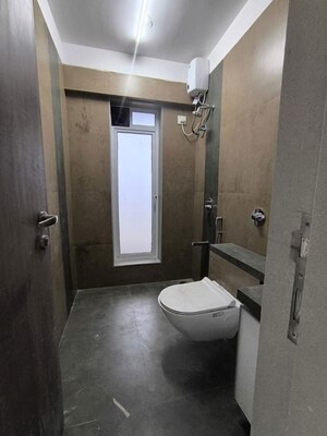 Bathroom in 3 BHK Apartment at Shreenathji Celestial Heights, Malad West – for Rent