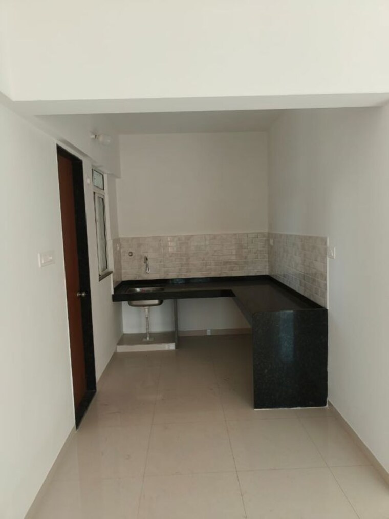Kitchen, dynamic-imperia-plus 2 Bedroom 930 Sq.Ft. Apartment In Pisoli Pune 10164909