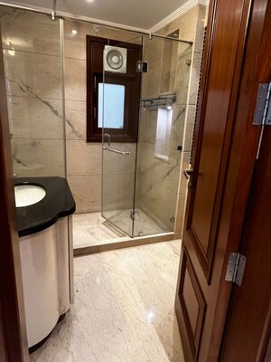 Bathroom in 4 BHK Builder Floor at Pamposh Enclave – for Sale