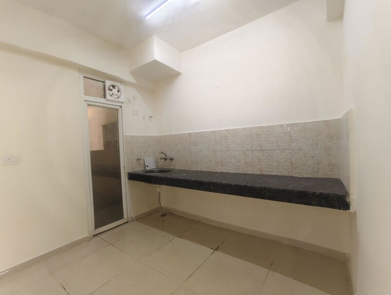 Kitchen, signature-global-the-millennia 3.5 Bedroom 850 Sq.Ft. Apartment In Sector 37d Gurgaon 10165234