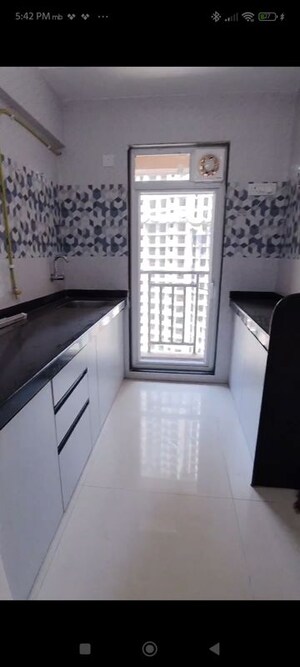 Kitchen in 1 BHK Apartment at Raunak Bliss, Ghodbunder Road – for Rent