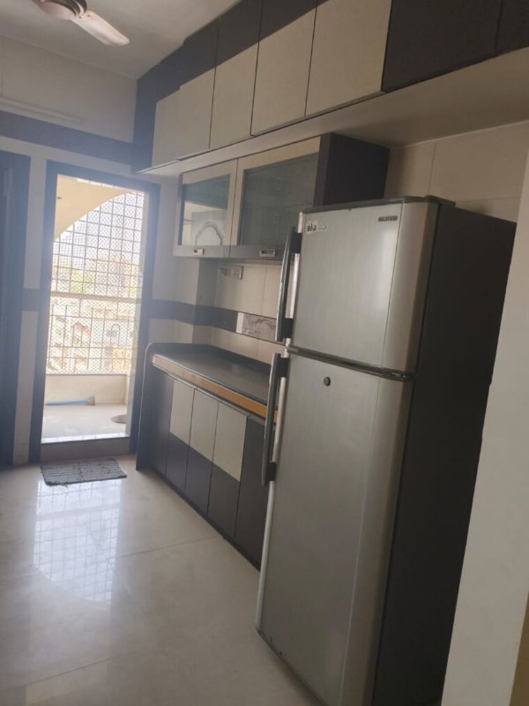 Kitchen, adajan 3 Bedroom 1200 Sq.Ft. Apartment In Adajan Surat 10121745