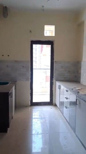 Kitchen in 2.5 BHK Apartment at Charms Castle, Raj Nagar Extension – for Rent