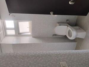 Bathroom in 2 BHK Apartment at Urban Axis Urban Woods, Sushant Golf City – for Sale