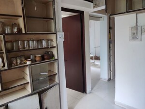 Kitchen in 1.5 BHK Apartment at Alkapuri Society – for Sale