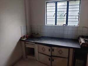 Kitchen in 1.5 BHK Apartment at Alkapuri Society – for Sale