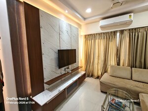Living Room in 2 BHK Apartment at Rustomjee Azziano Wing I, Thane West – for Sale