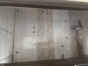 Bathroom in 3 BHK Apartment at Charms Castle, Raj Nagar Extension – for Rent