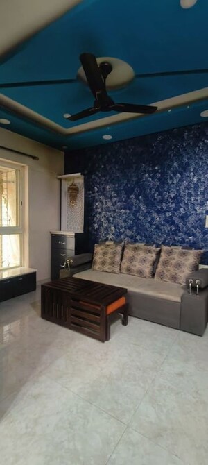 Living Room in 1 BHK Apartment at Lodha Amara, Kolshet Road – for Sale