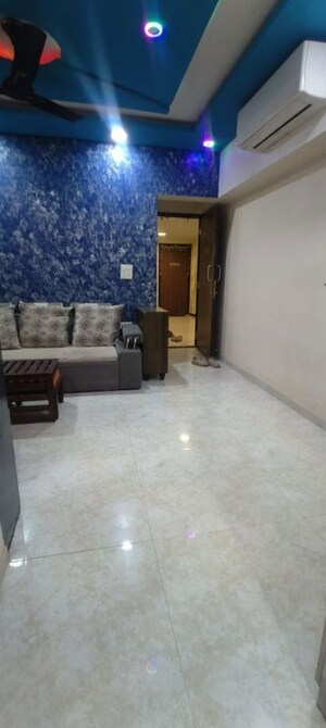 Living Room in 1 BHK Apartment at Lodha Amara, Kolshet Road – for Sale