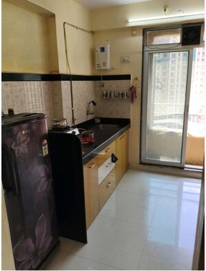 Kitchen in 2 BHK Apartment at Mahavir Kalpavruksha, Ghodbunder Road – for Sale