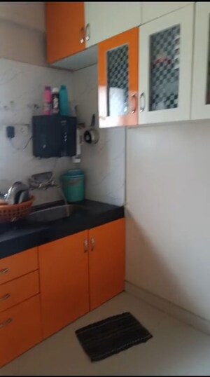 Kitchen in 2 BHK Apartment at Shivaneri CHS, Pimple Gurav – for Sale