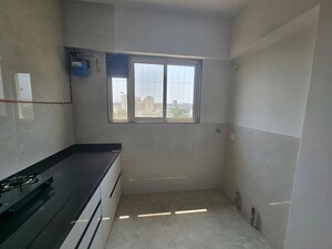 Kitchen in 3 BHK Apartment at Shreesha Devki CHS, Kothrud – for Rent