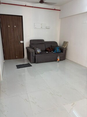 Living Room in 1 BHK Apartment at Runwal Gardens, Dombivli East – for Rent