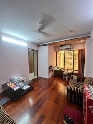 Living Room in 1 BHK Apartment at Lokhandwala Complex – for Rent