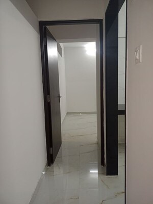 Building Lobby in 1 BHK Apartment at CH Om Aarti, Borivali West – for Rent